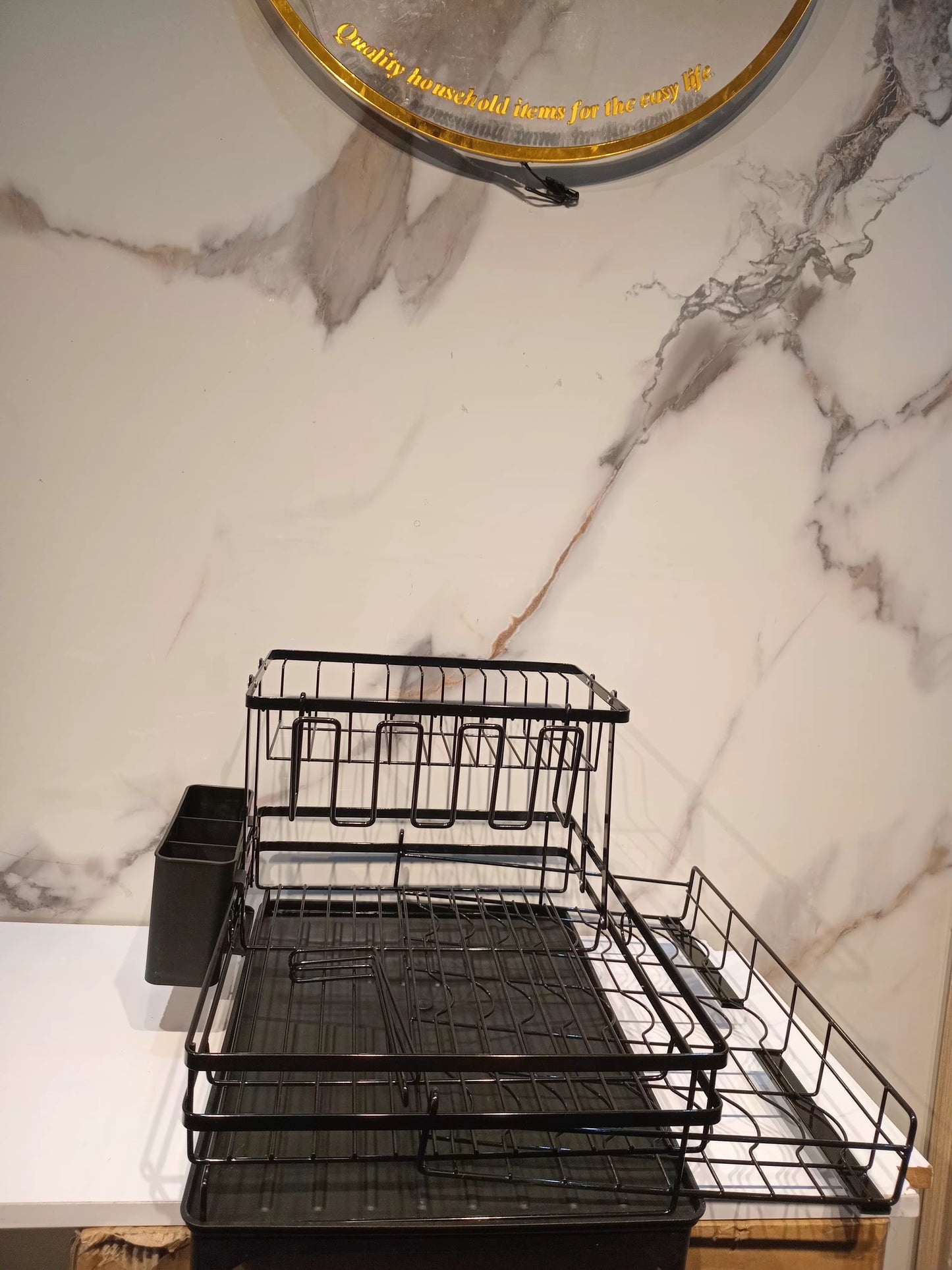Dish draining rack with extendable bottom